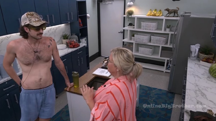 Angela and Barrett talking in the Big Brother kitchen at 6:29 pm
