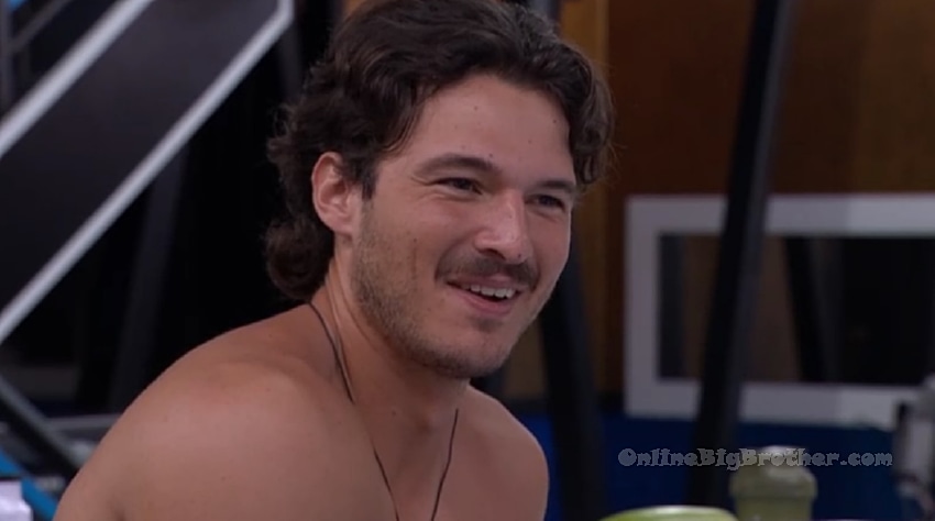 Rome smiling during late-night kitchen hangout with houseguests