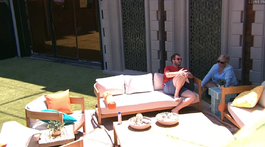 Devens and Angela talking strategy on the outdoor patio at 12:44 PM