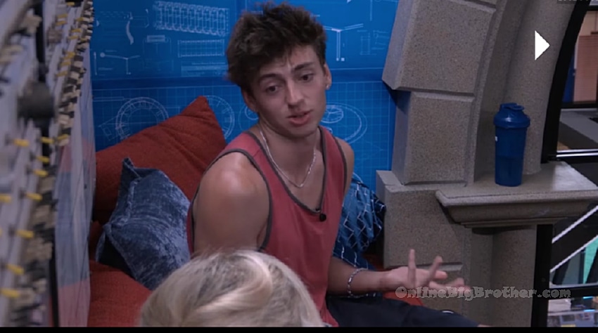 Drew talking with houseguests in the Big Brother living area