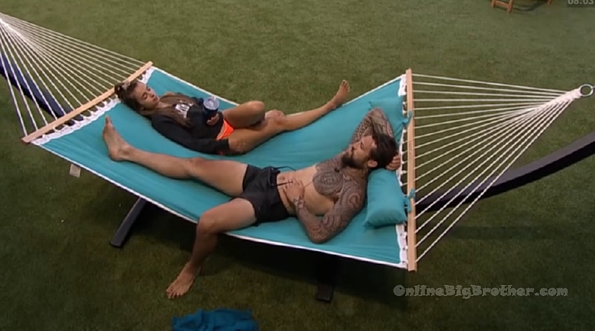 Two houseguests relaxing on the backyard hammock during the 8:00 pm downtime segment