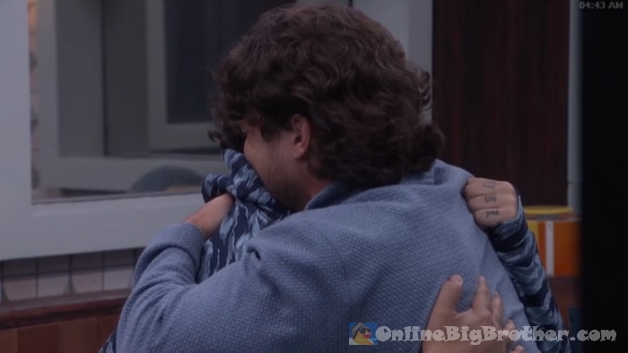 Rome and Jason share a hug in the kitchen at 4:43 AM after Jason reveals his TV secret and the two align on their game plan