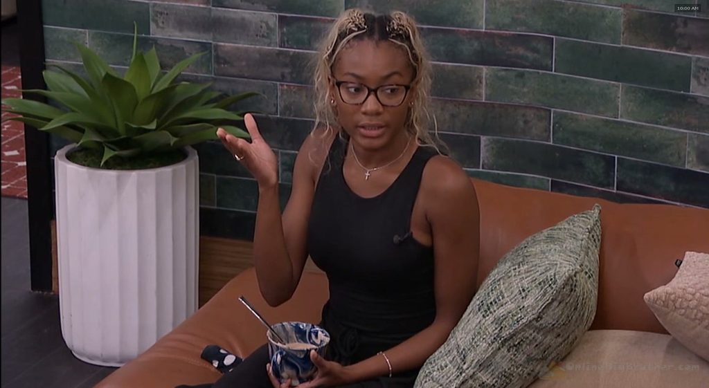 Taylor sits on the HOH room floor facing Dee and Angela on the bed during the Saturday morning confrontation