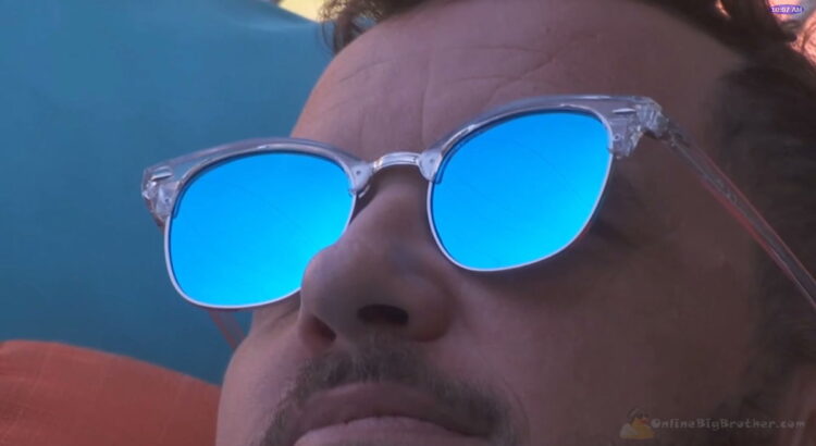 Close up of Deven's face while he is on the hammock alone